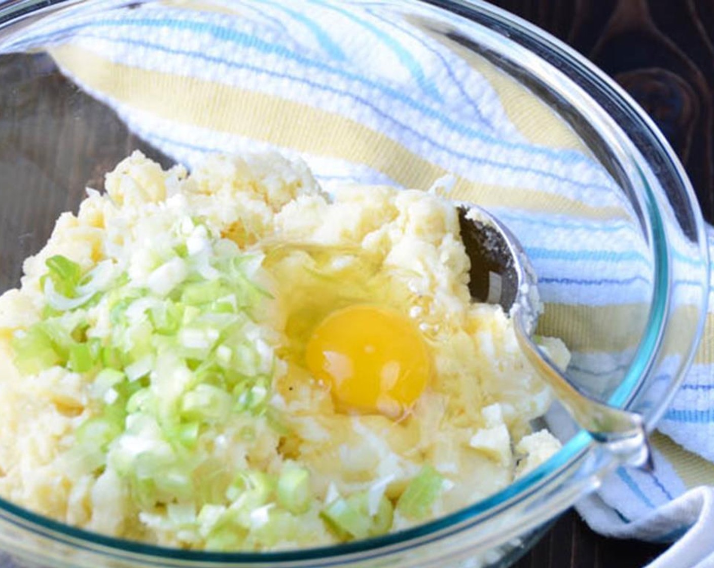 step 2 In a large bowl, combine the Mashed Potatoes (3 cups), Scallion (1 bunch),  Egg (1), Milk (1/3 cup), and Blue Cheese (2/3 cup). Stir until well combined.