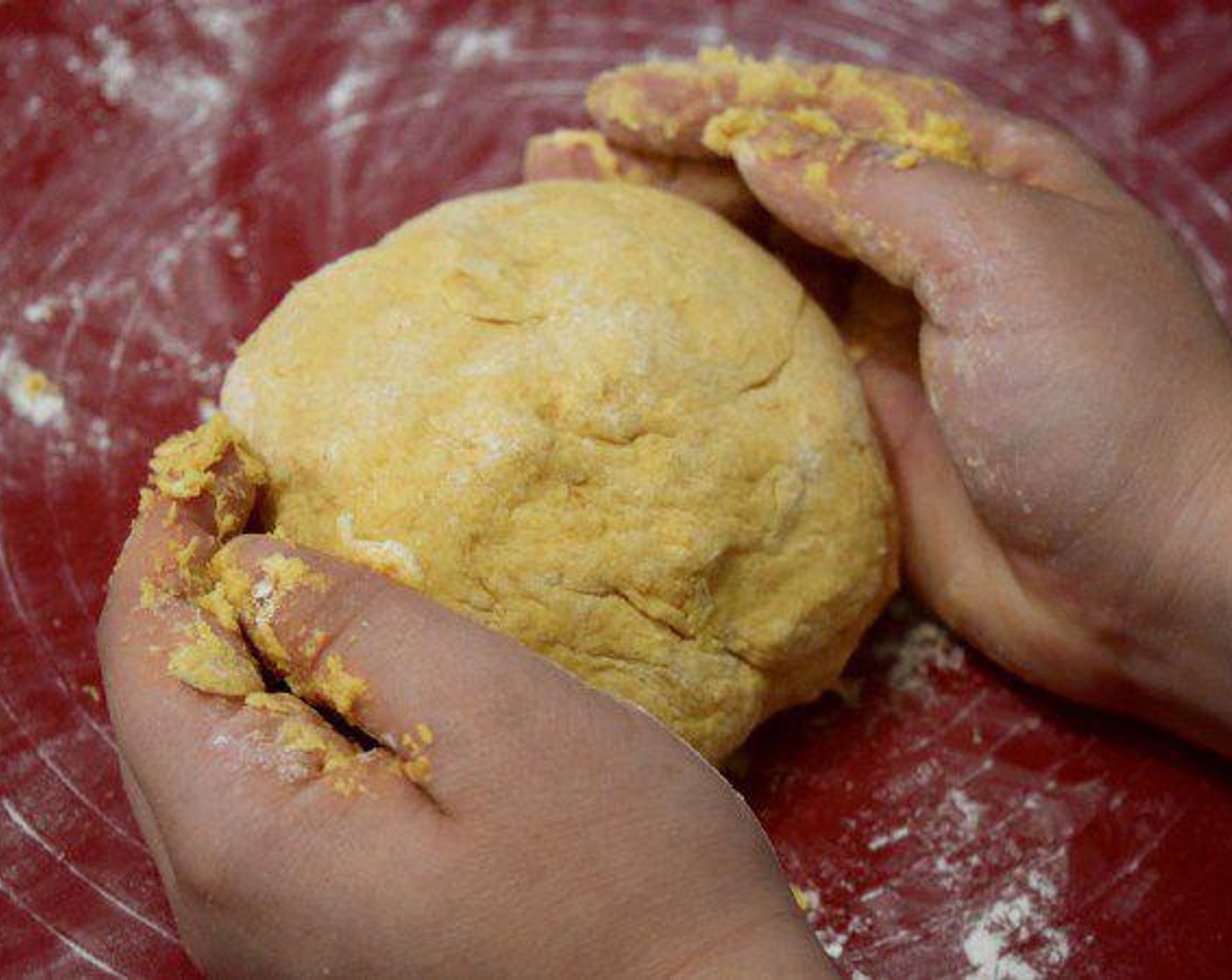 step 7 Clear some space on your counter or silicone mat. Then, place the dough on the floured surface and knead the dough, being very careful not to overwork it. You will want to stop when the dough comes together, but still has a slightly lumpy texture. If your dough is too sticky add in some more flour around a 1/4 cup at a time. Then, place the dough in a bowl and put it back in the fridge/freezer and allow to chill for 5 minutes.