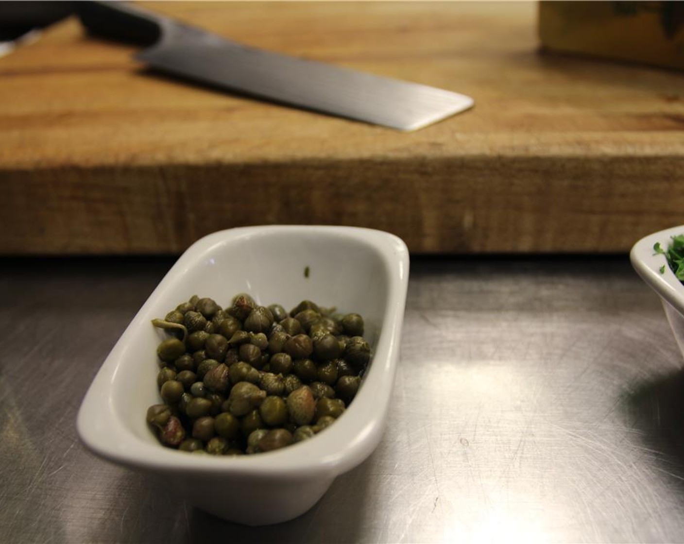 step 1 Rinse capers in cold running water. Pat dry and chop them up.