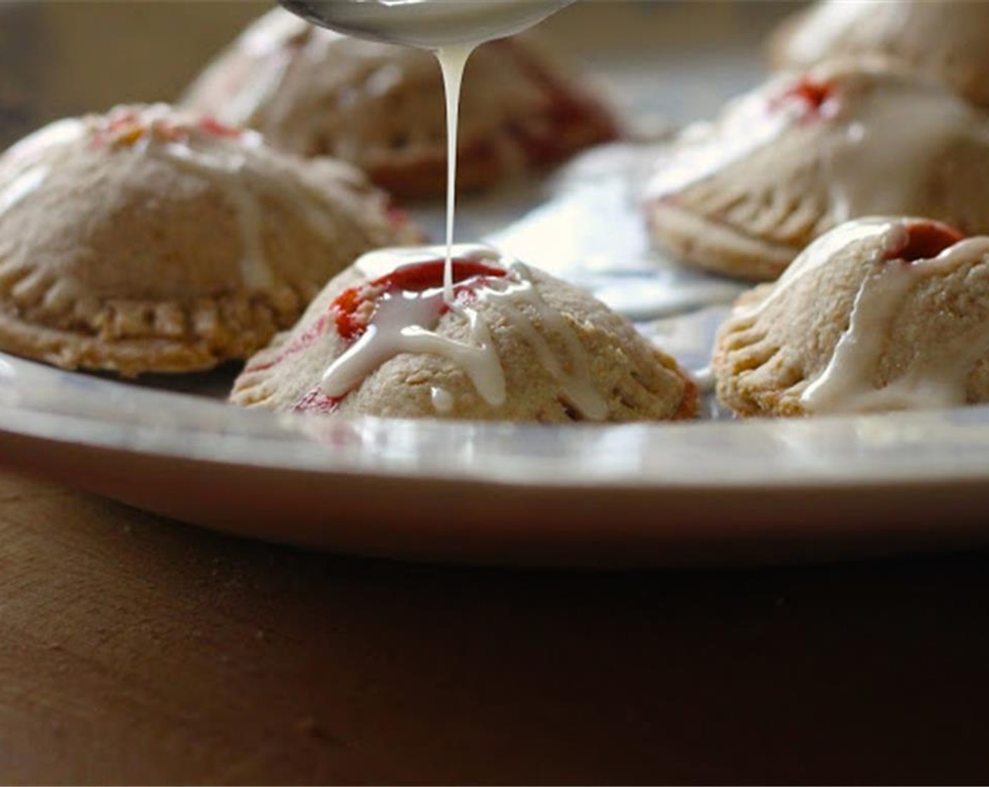 step 14 Remove pies from oven, drizzle with icing and serve hot or cold.