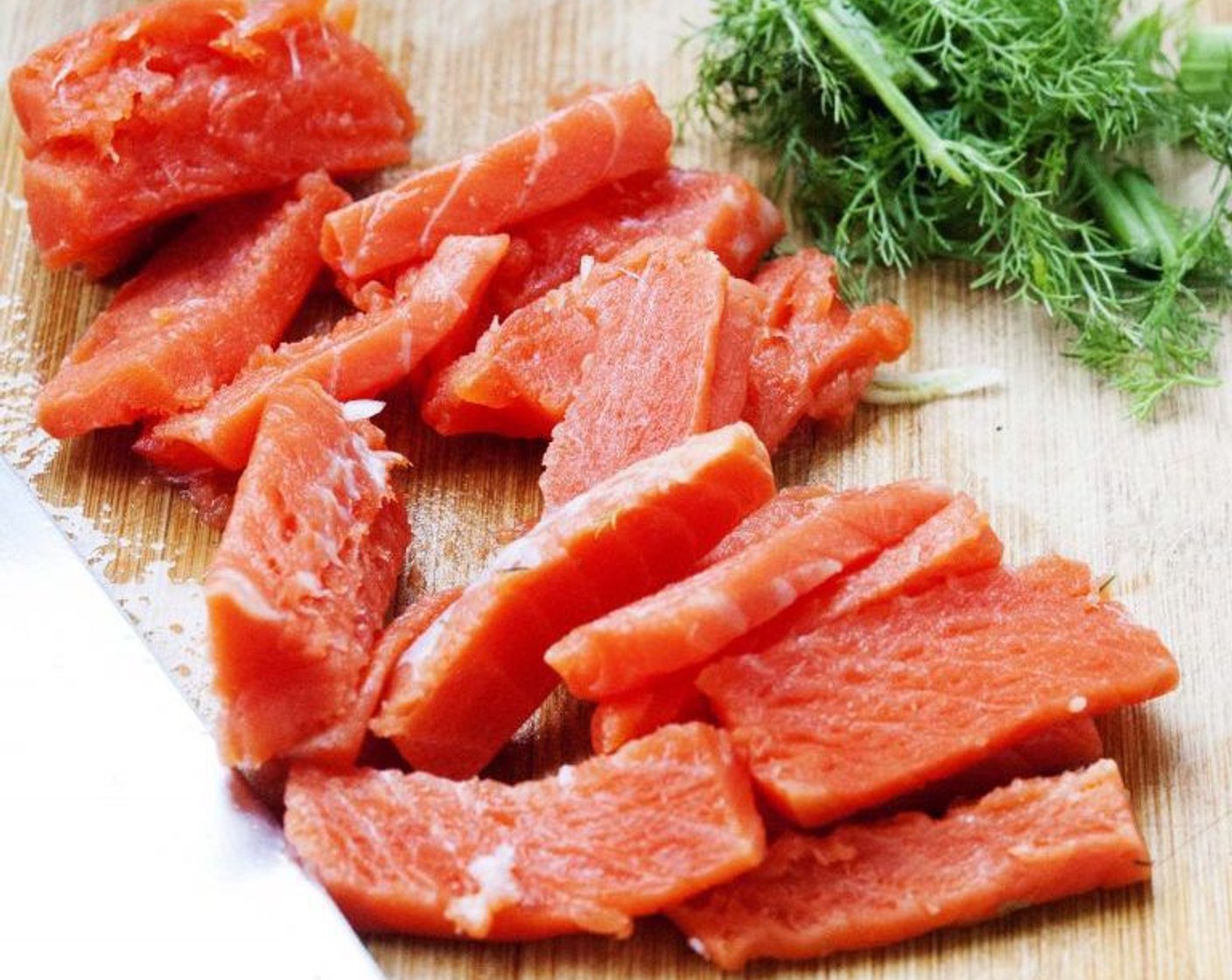step 7 Slice up the Wild Salmon Fillets (3.5 oz) and add that now to your risotto. Gently stir it in until it changes in color.