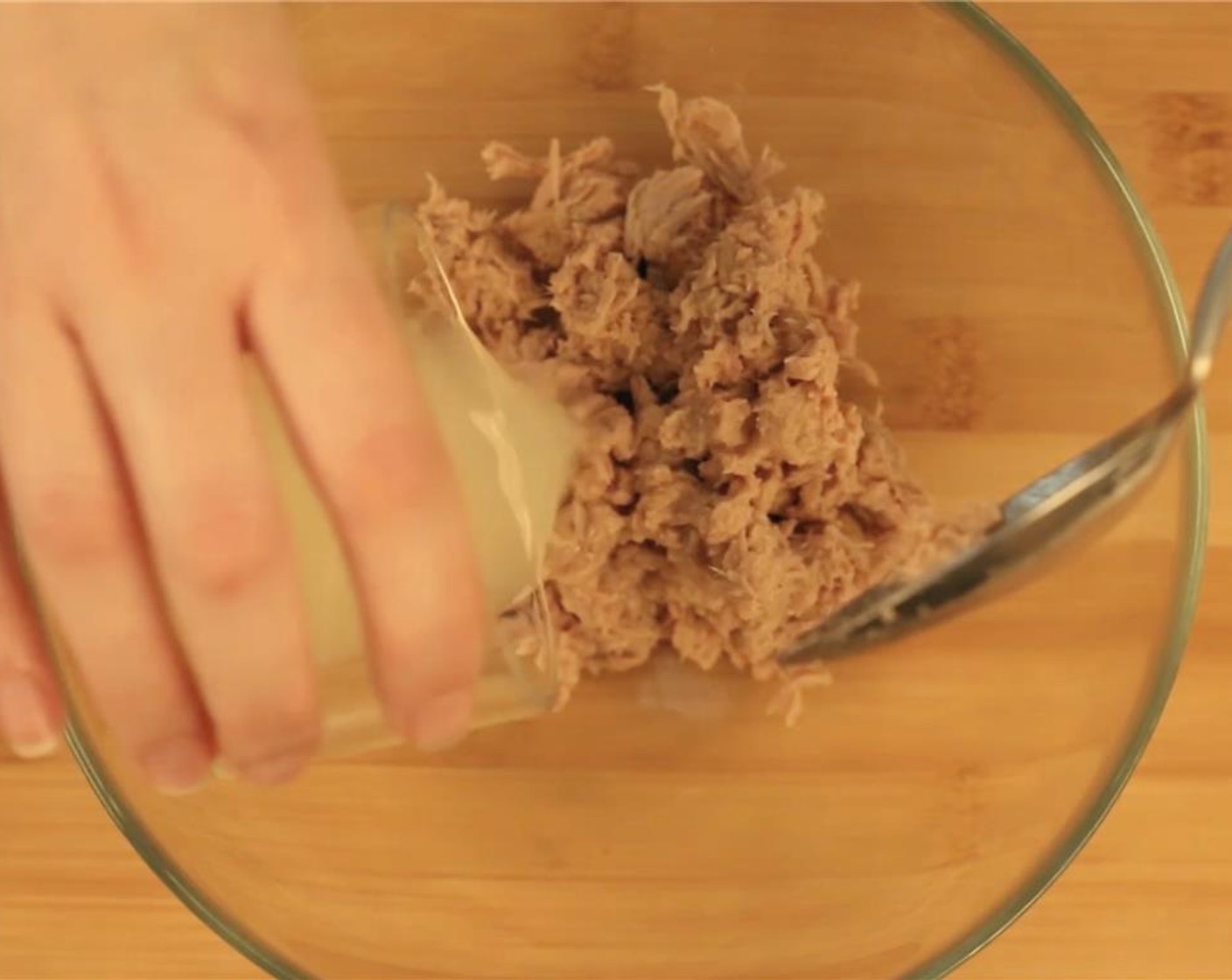 step 1 In a small bowl, combine Canned Tuna (1 can) and juice from Lemon (1).