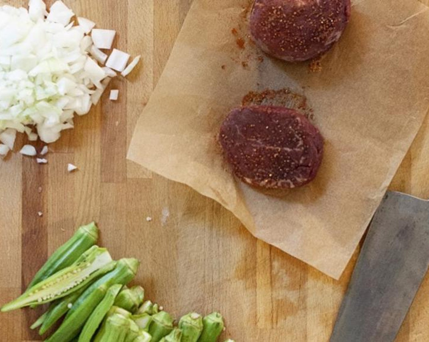 step 4 Prepare your mise en place: Pick and finely chop Fresh Parsley (2 sprigs) and Fresh Oregano (2 sprigs). Slice Okra (1 2/3 cups) in half lengthwise. Season the Filet Mignon (2) on all sides with Seasoned Salt (1 Tbsp) and let stand at room temperature.