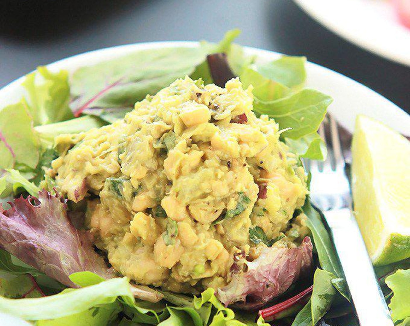 step 5 For a salad, place Salad Greens (to taste) on a plate and place a scoop of chickpea salad on top of the greens.