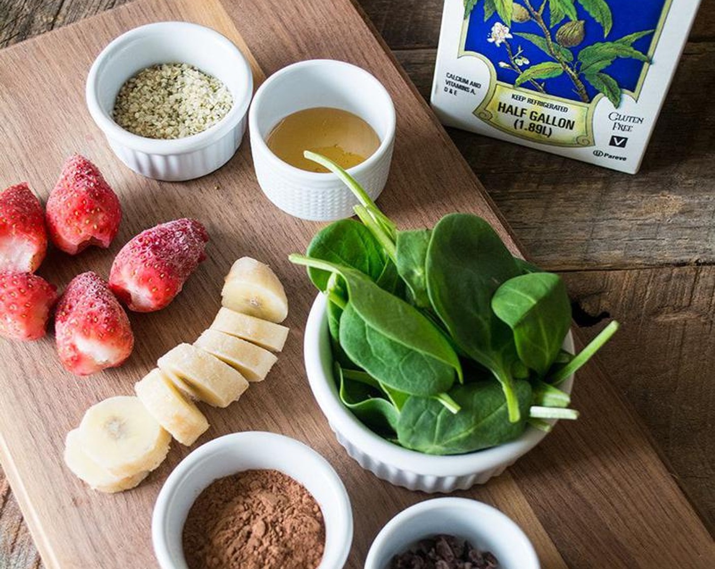 step 2 Add Nonfat Plain Greek Yogurt (1/2 cup), Honey (1 Tbsp), Fresh Baby Spinach (2 cups), Hemp Hearts (2 Tbsp), Unsweetened Cocoa Powder (2 Tbsp), Cacao Nibs (1 Tbsp), and Almond Milk (1 cup) to a blender or nutribullet and blend on high for 45 to 60 seconds or until a smooth, creamy texture.