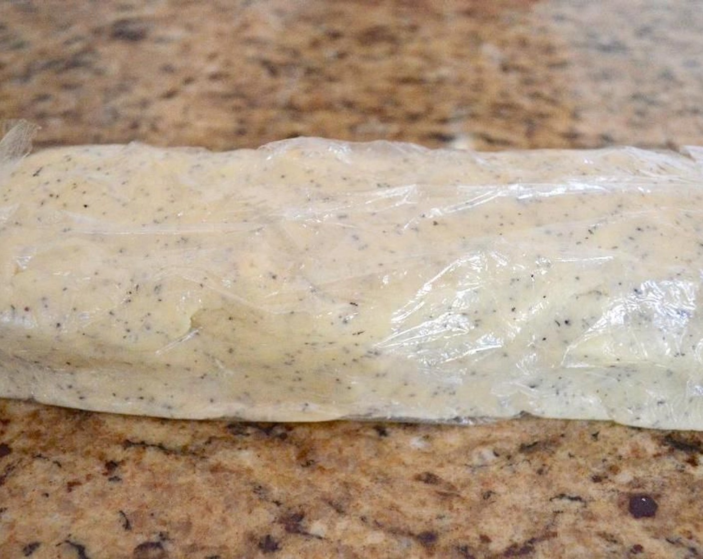 step 3 Turn the dough out onto a big sheet of plastic wrap and form it into a long rectangle about 2 inches in height. Wrap it up and set it in the refrigerator to chill for an hour. This will make the dough easier to slice and the butter cold when it hits the oven.