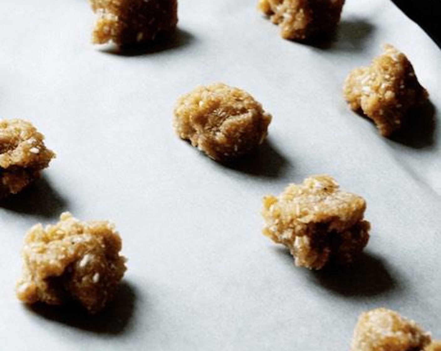 step 4 Using a small cookie scoop, scoop the dough by rounded teaspoons onto the prepared baking sheet.