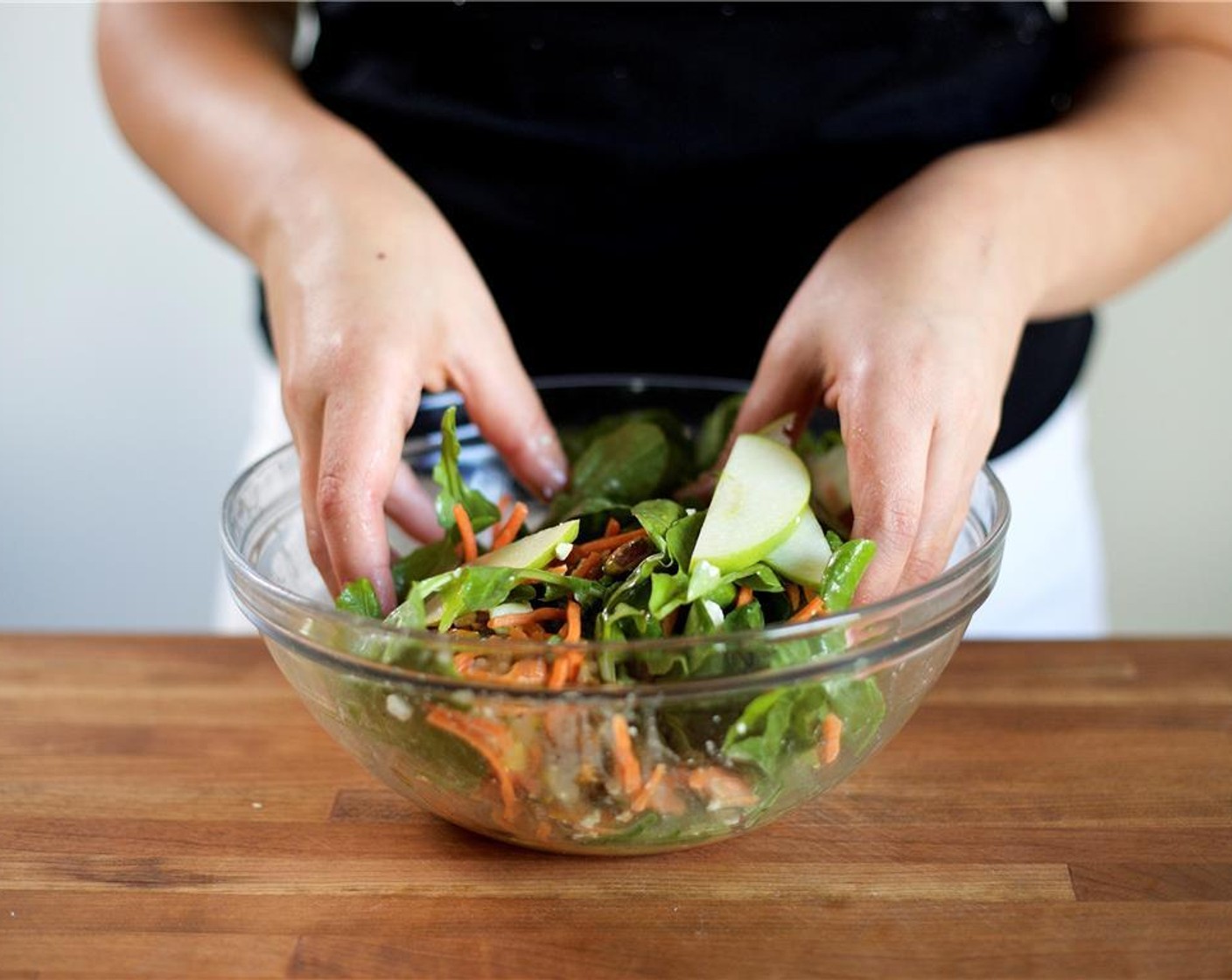 step 7 Gently toss the salad and set aside. Slice the chicken breasts on a diagonal into quarter inch thin slices.