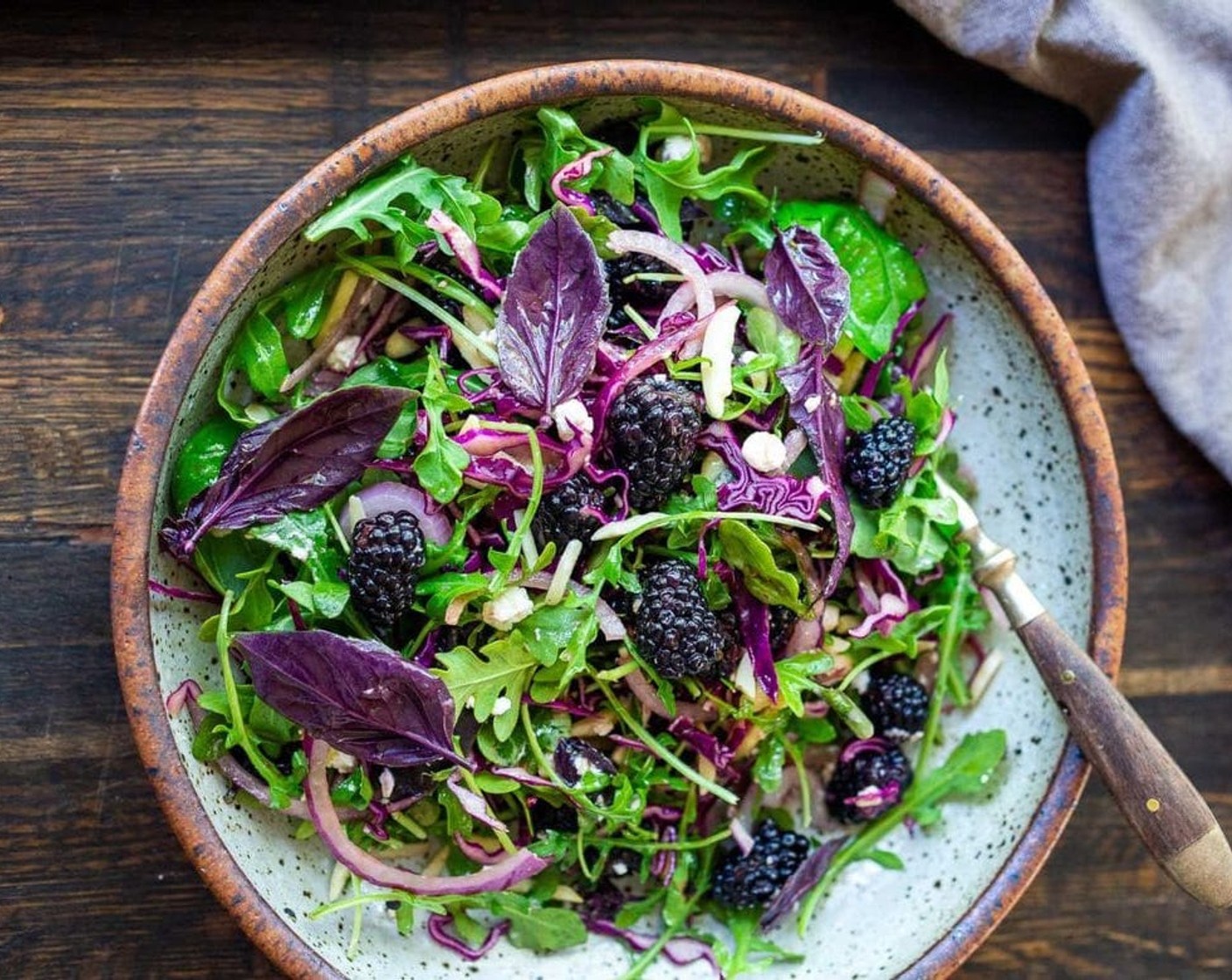 step 3 Place dressed greens onto a platter or divide onto plates. Top with Fresh Blackberry (1 cup), Goat Cheese (1/3 cup), a few basil leaves, toasted Slivered Almonds (1/4 cup) and Fresh Chives (1 Tbsp). Serve and enjoy!