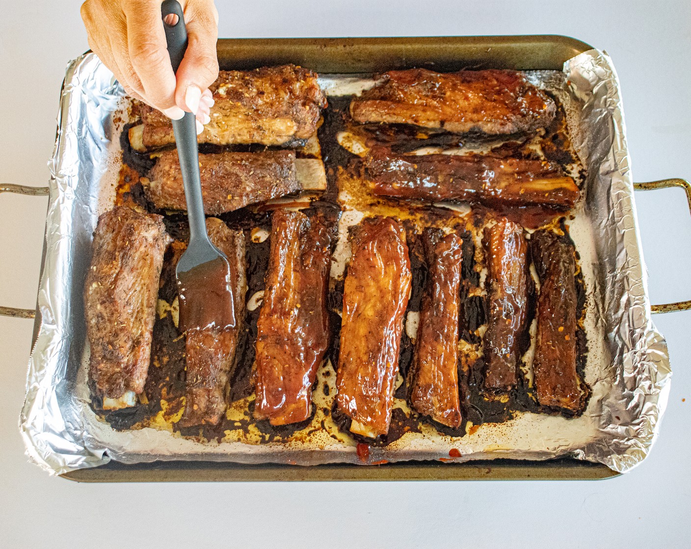 step 8 Remove ribs and brush with Barbecue Sauce (as needed).