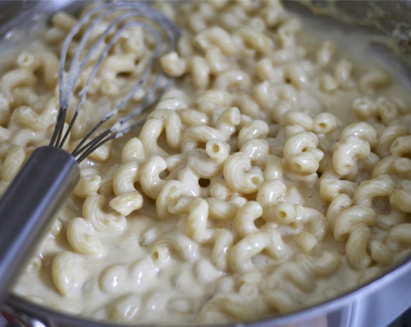 step 7 Cook Cavatappi Pasta (8 oz) in large pot of boiling salted water until just al dente. Drain and return to pot. Add cheese sauce and stir.