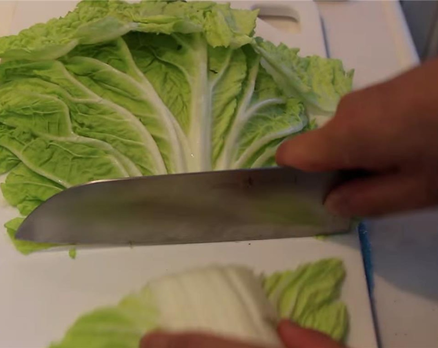 step 1 Remove one leaf from the Napa Cabbage (1 head). Cut the leaf into thin strips.