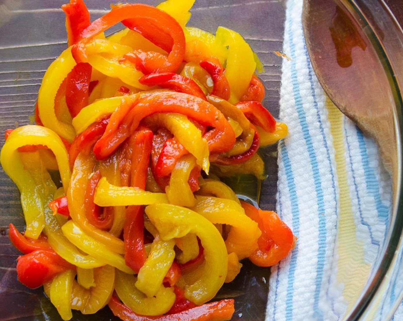 step 7 When the peppers are cool enough to handle, remove the skins, stems and seeds and cut the peppers into thin strips. Transfer peppers to a large bowl.