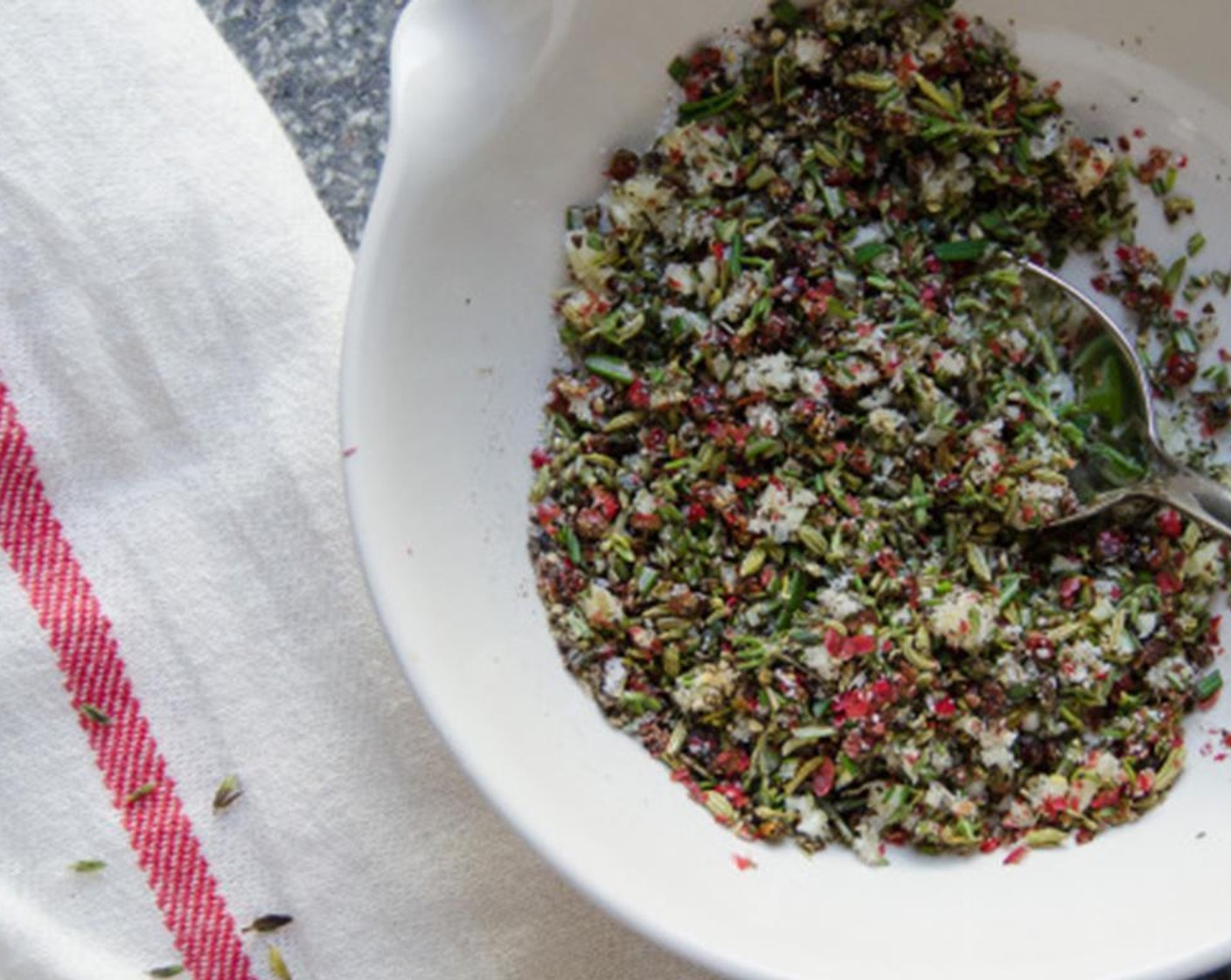 step 3 Add the garlic, Kosher Salt (1/2 Tbsp), rosemary, thyme and Ground Black Pepper (1/2 Tbsp) to the bowl. Stir to combine.