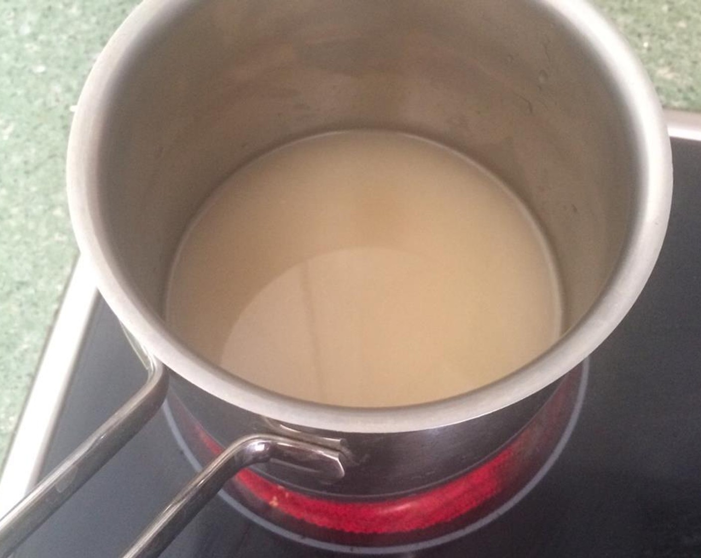 step 2 While the onion is frying, put the Chicken Soup (1 cup) in a pot and bring it to a boil.