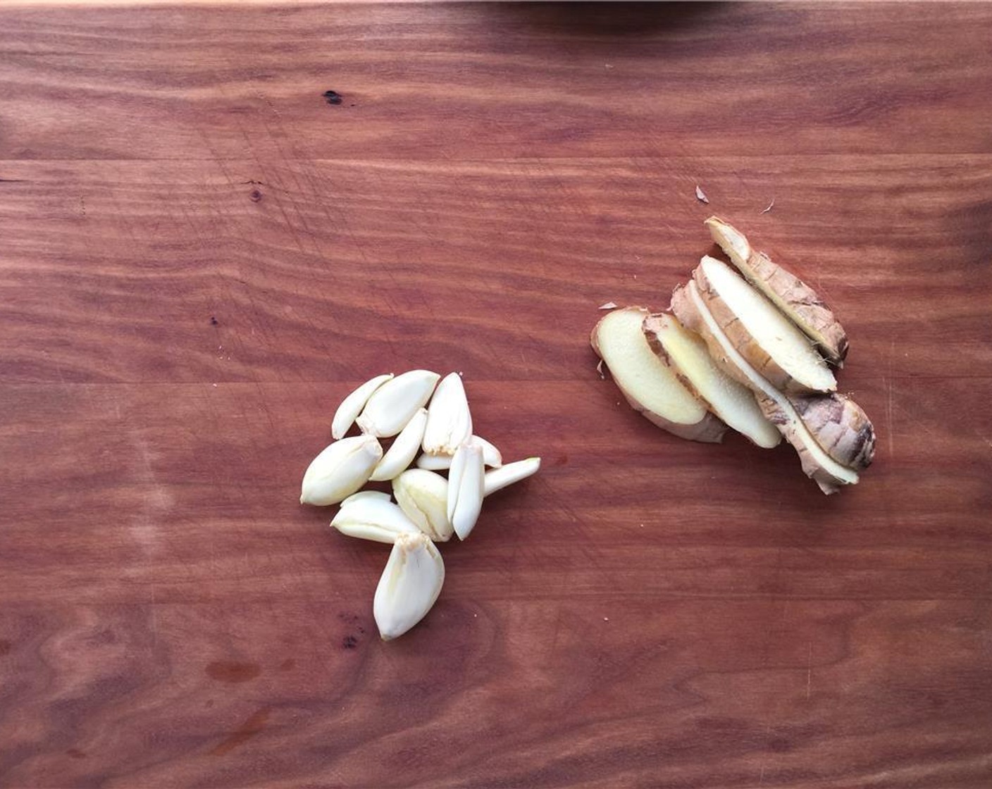 step 2 Peel and crush the Garlic (1/2 bulb). Wash and slice the Fresh Ginger (1 in).