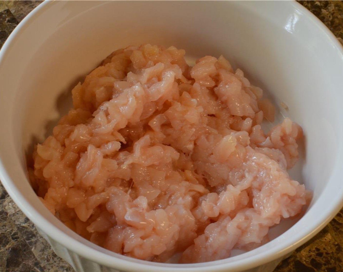 step 2 Mince the Chicken Breast (1) into tiny pieces. Scoop it up into a mixing bowl.