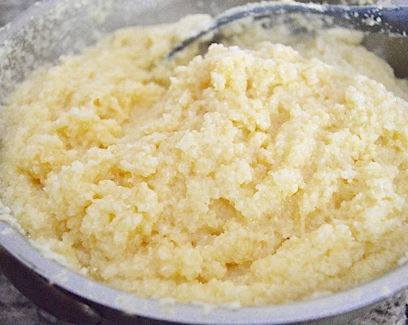 step 6 Take the polenta off the heat and stir in the Butter (4 Tbsp), Heavy Cream (1 Tbsp), and Salt (1 pinch) for seasoning.