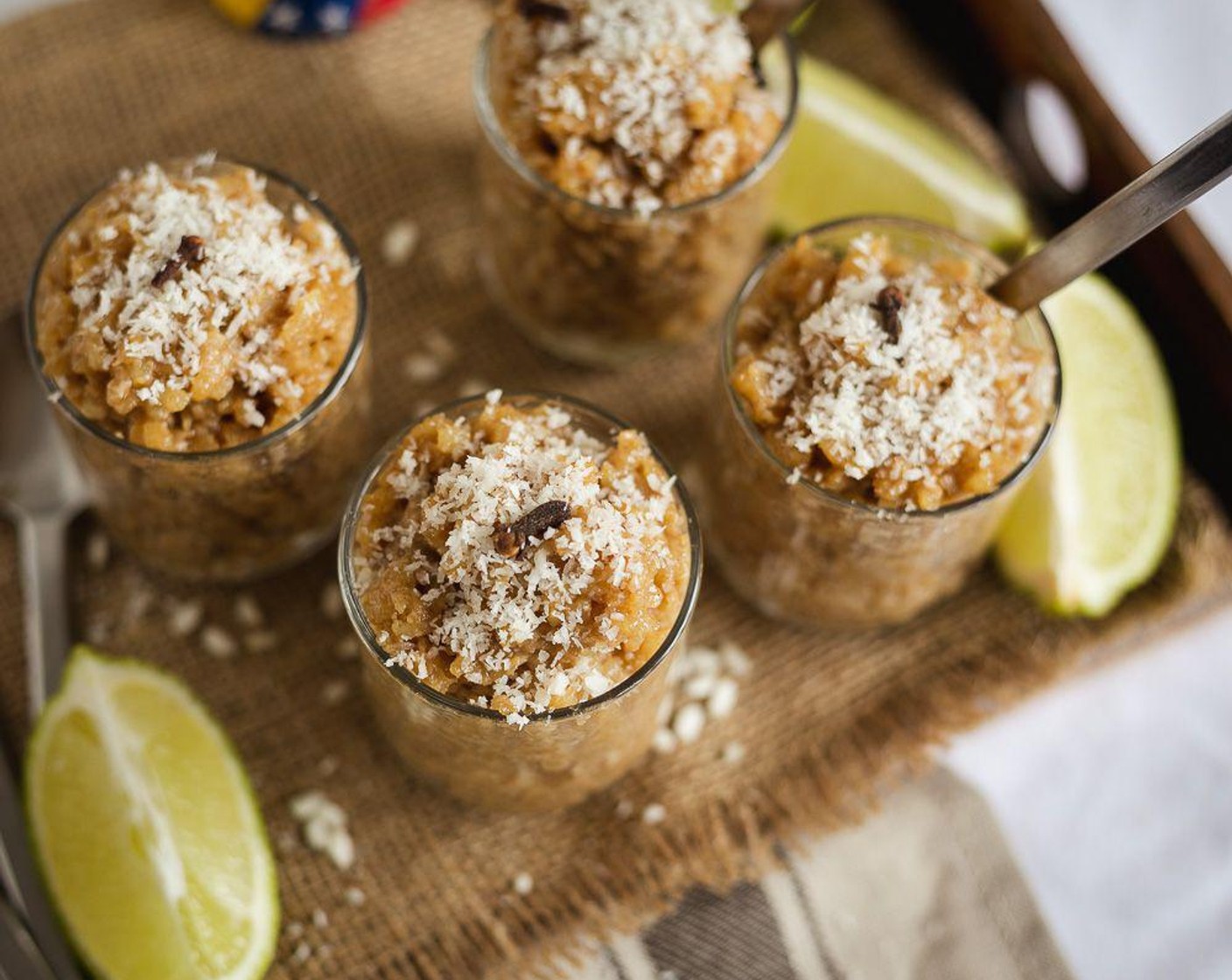 step 5 Once it is cooled down, serve with more shredded coconut on the top and a clove for decoration. Serve and enjoy!