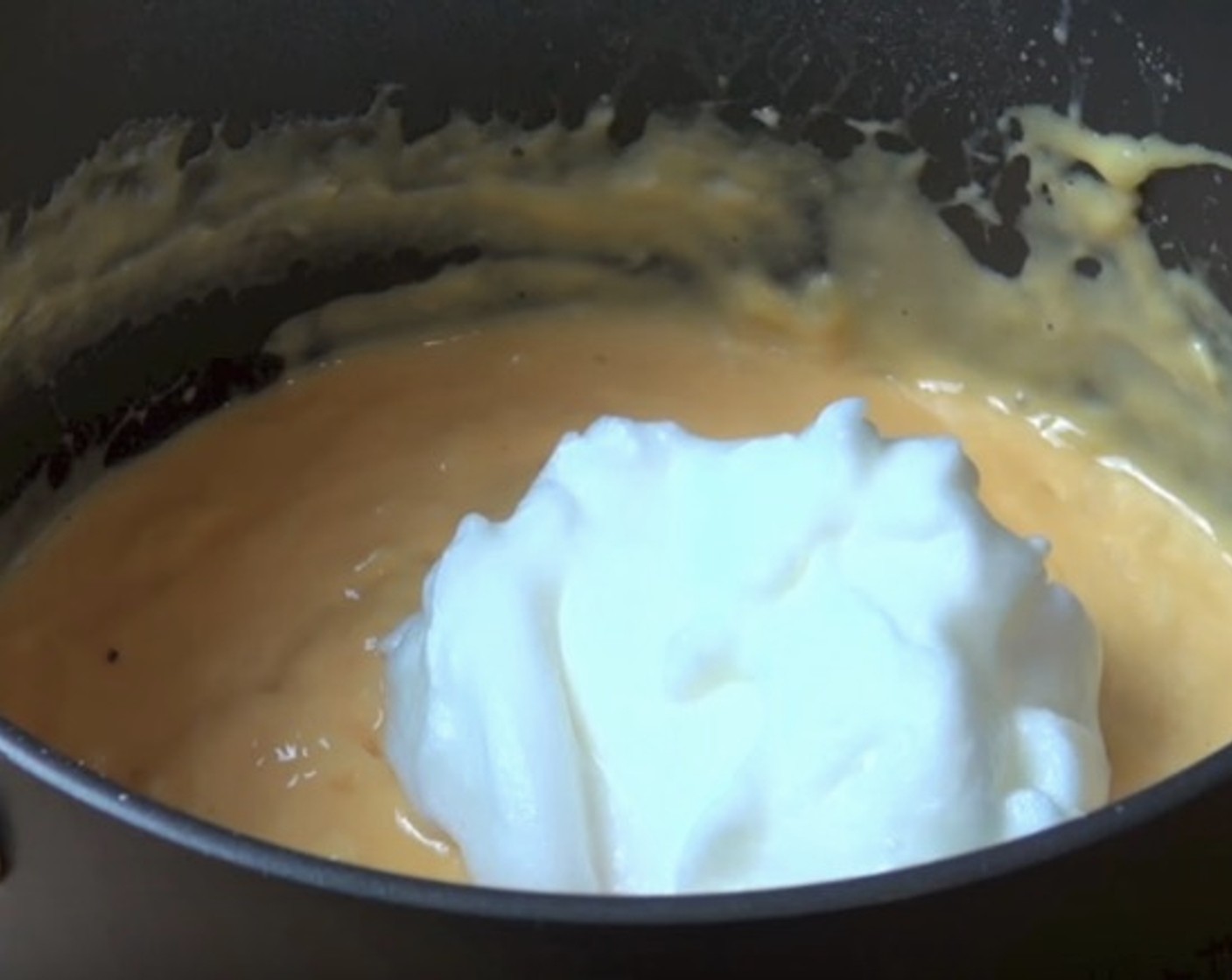 step 7 Whisk Egg Whites until mixture forms soft peaks. Gently fold it into the cheese mixture 1/4 at a time.