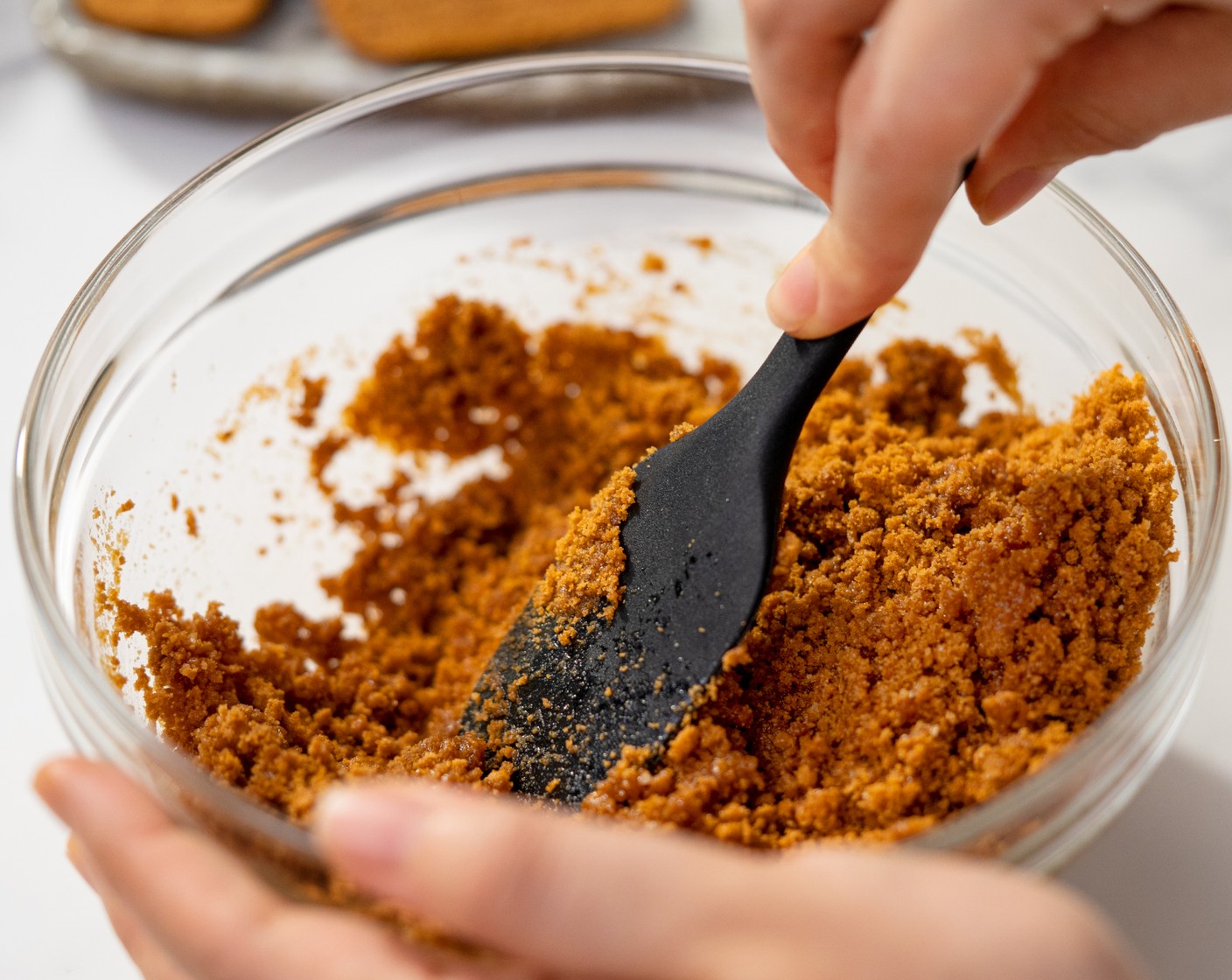 step 2 In a mixing bowl, add Biscoff Cookies (1 2/3 cups) and Unsalted Butter (1/4 cup). Mix until it is well combined.