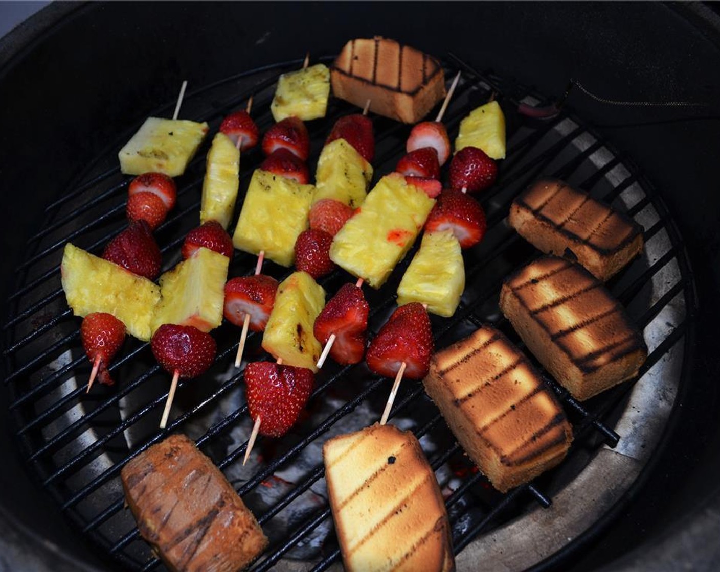 step 2 Place the skewers and pound cake diagonally on the grill grate and cook until grill marks appear. Flip and repeat.
