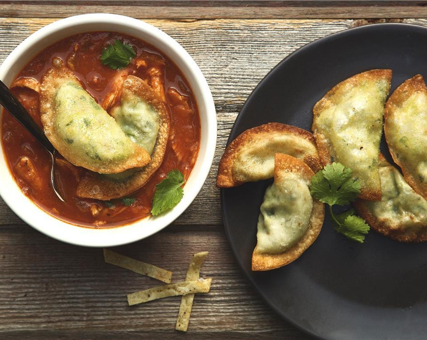 step 17 Divide the remaining tortilla chips evenly between two bowls. Top with shredded Jack and Cheddar Cheese (3/4 cup). Ladle the soup into each bowl and add a few of the guacamole wontons. Garnish with remaining cilantro and serve!