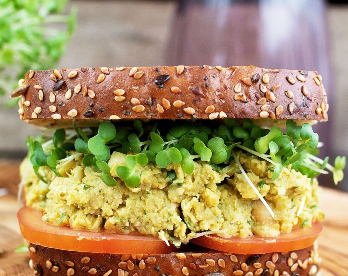 step 2 To assemble your sandwiches, spread the chickpea paste, Tomato (1) and the rest of the Baby Watercress (1 tsp) on the Whole Grain Bread (4 slices) and serve.