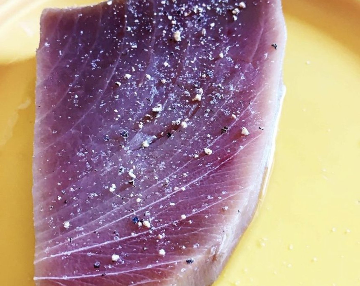 step 4 Season the Fresh Tuna Steak (2) with Himalayan Rock Salt (to taste) and Ground Black Pepper (to taste). Cook them on a hot grill or grill pan for about 2 minutes per side, or less if you like it more on the rare side!
