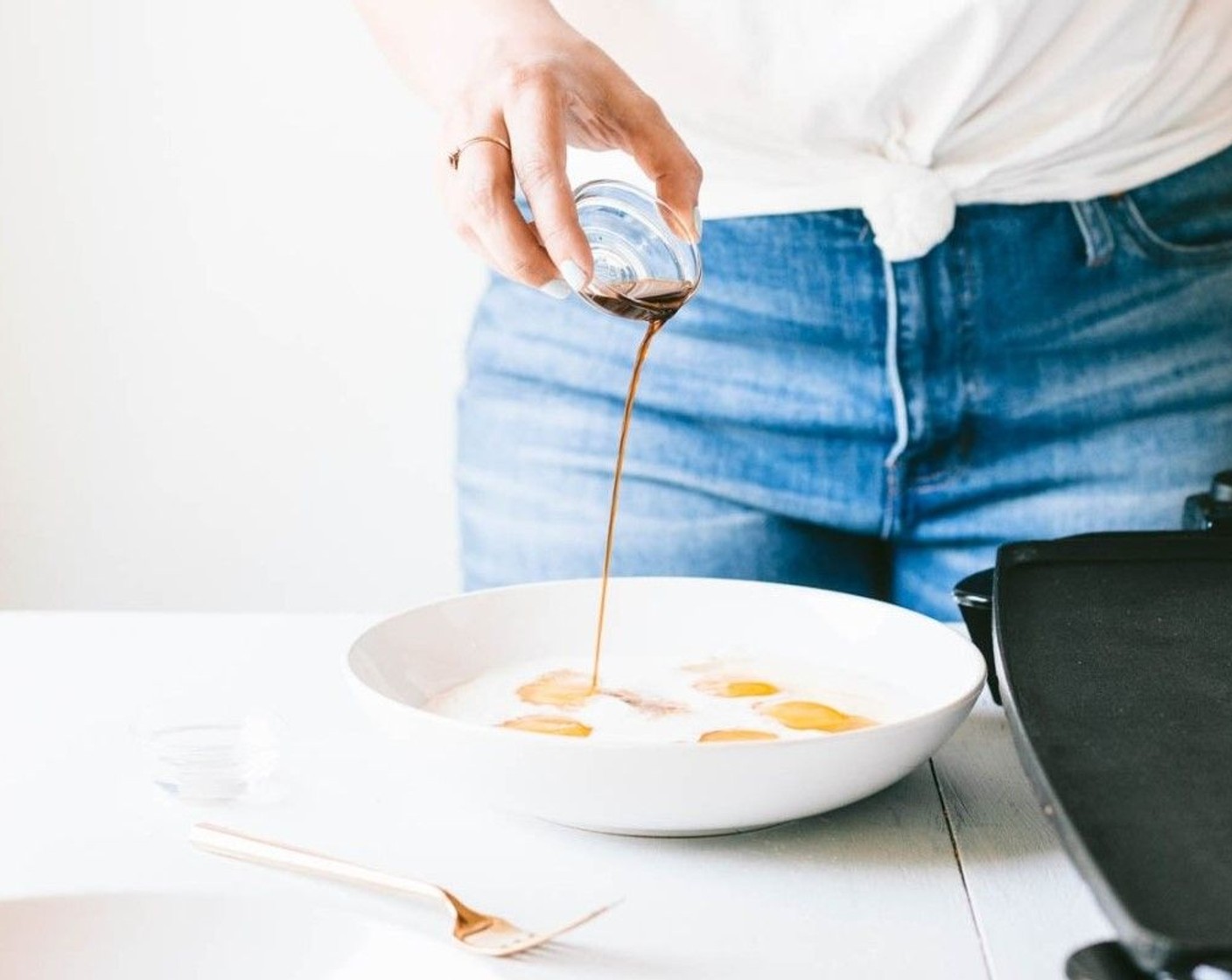 step 2 In a medium-sized bowl, whisk the Eggs (5), Half and Half (1/2 cup), Vanilla Extract (1 tsp), Almond Extract (1/2 tsp), and Ground Nutmeg (1/2 tsp) together. Place the Sliced Almonds (2 cups) in another medium-sized bowl.