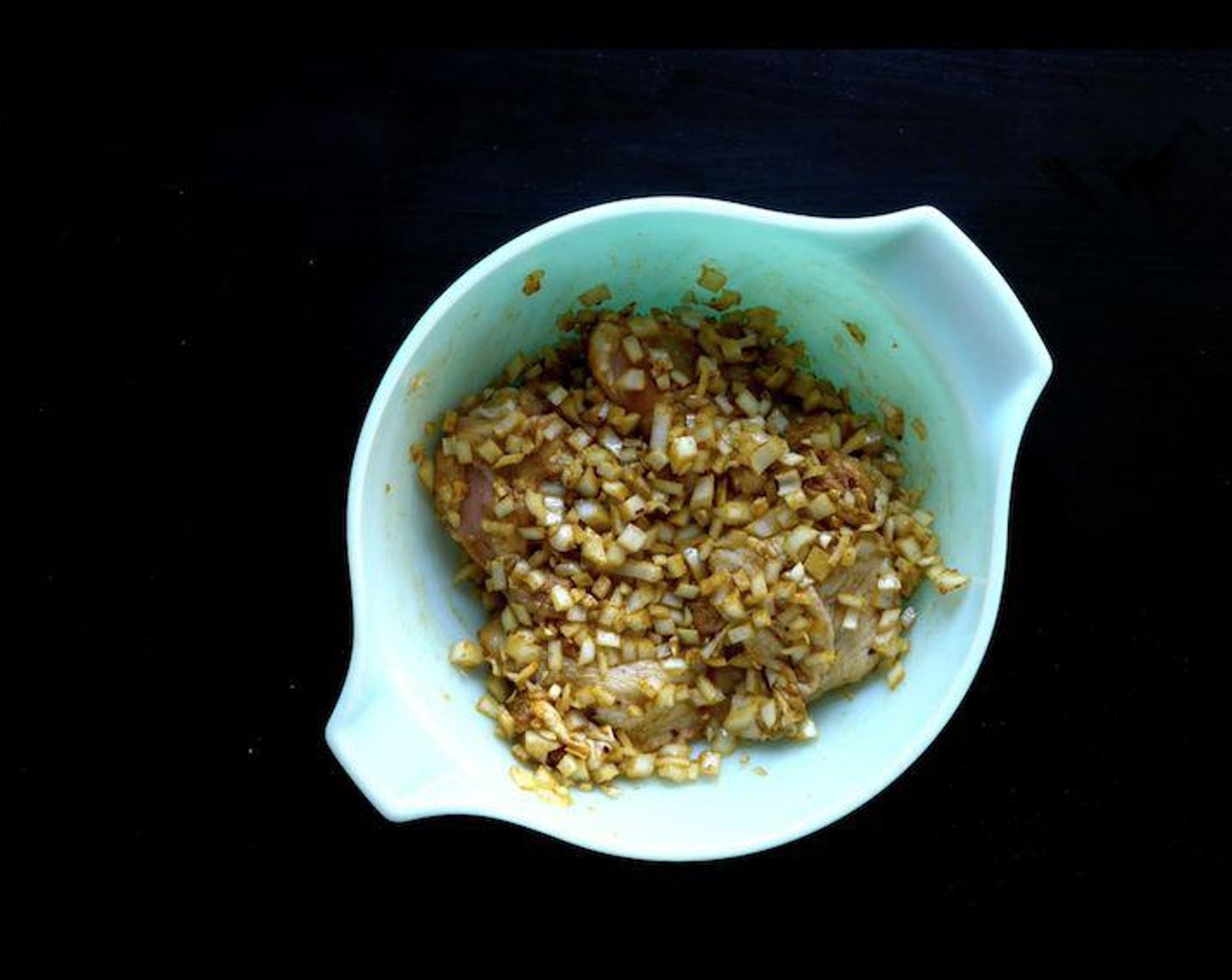 step 1 In a large bowl, marinade the Bone-In Chicken Thighs (6) overnight in the refrigerator in the Neutral Oil (4 Tbsp), Yellow Onion (1), Garlic (5 cloves), Ground Cumin (1 tsp), Ground Coriander (1 tsp), Ground Turmeric (1/2 tsp), Crushed Red Pepper Flakes (1/2 tsp), Salt (to taste) and Ground Black Pepper (to taste).