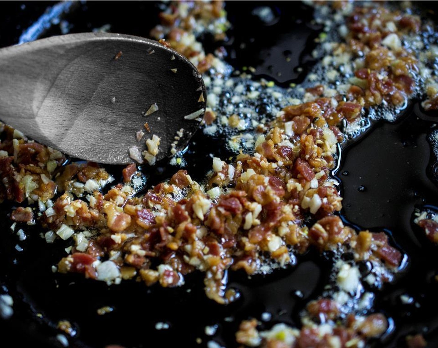 step 3 Then add the Garlic (4 cloves), stirring constantly, cooking for 1 more minute. Turn off the heat and set aside. Do not pour off the fat, as it adds to the flavor and texture of the dish.