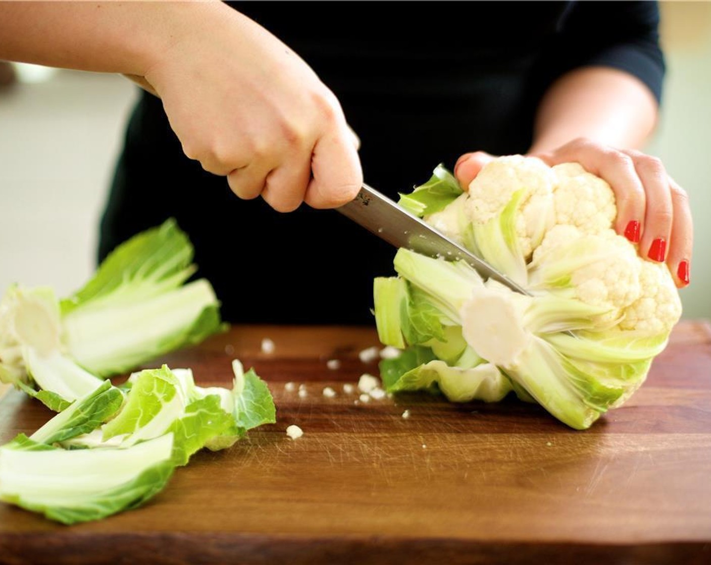 step 2 Trim the base of the Cauliflower (1 head) to remove the green leaves and the woody stem, and discard.