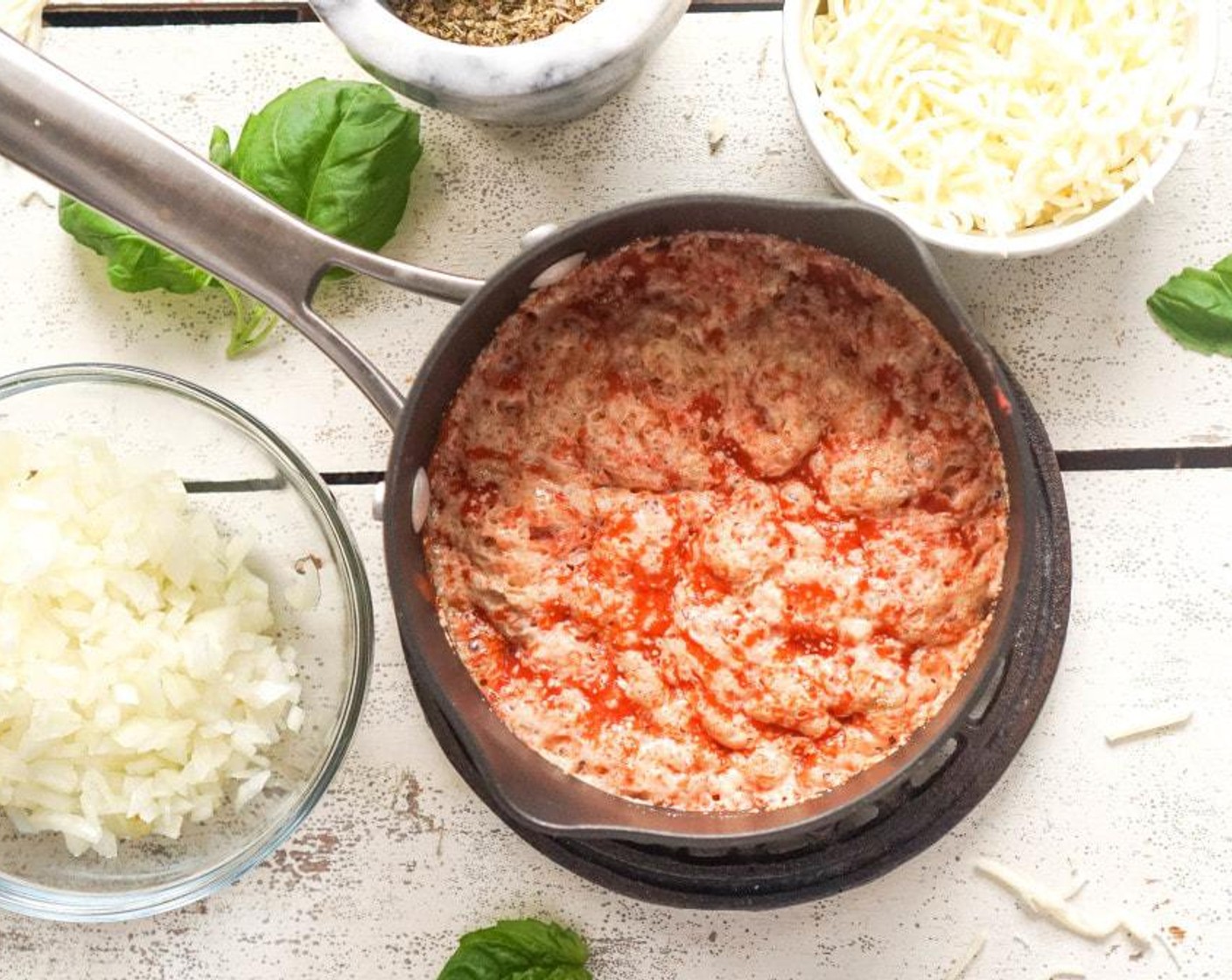 step 4 Add the Onion (1/4 cup), 1 clove of Garlic (2 cloves), Dried Basil (1 Tbsp), Dried Oregano (1 Tbsp), Celery Seeds (1/2 tsp), Salt (1/2 Tbsp), and Mozzarella Cheese (1 cup).