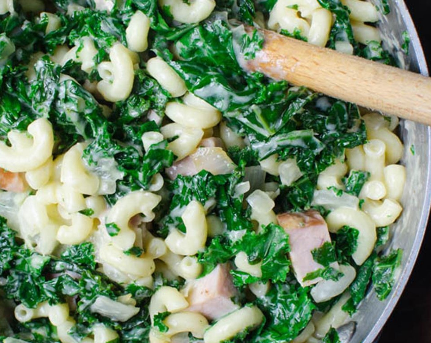 step 10 Add the noodles to the cheese sauce and stir until well coated. Add the noodle mixture to the kale mixture and mix until combined and transfer to the casserole dish.