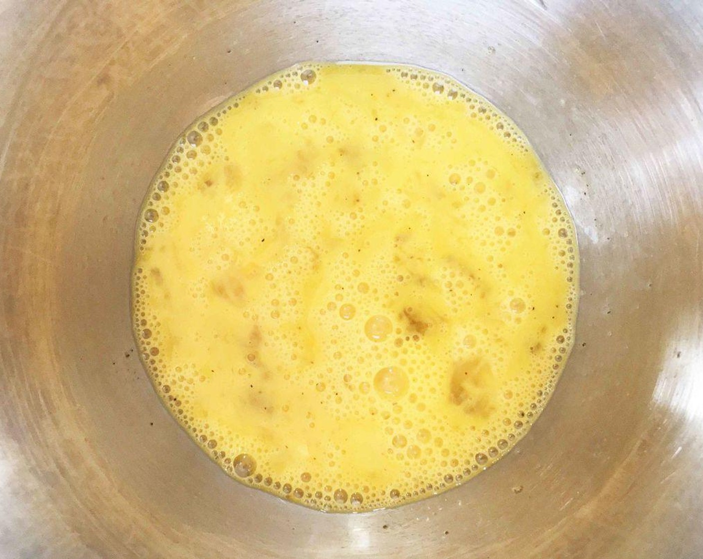 step 2 In a medium bowl, whisk together the Farmhouse Eggs® Large Brown Eggs (2), 2% Reduced Fat Milk (2 Tbsp), Salt (to taste), and Ground Black Pepper (to taste).