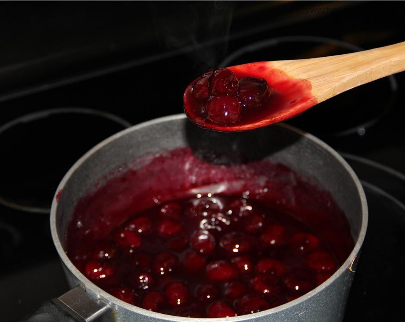 step 6 Reduce the heat to low. Simmer the cherry mixture stirring constantly until thickened. Remove from heat and cool for a few minutes.