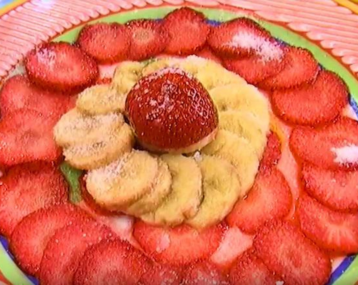 step 3 Slice your Bananas (3), and some strawberries on a separate dish. Sprinkle some sugar and Lemon (1). Make sure to keep the banana cover.