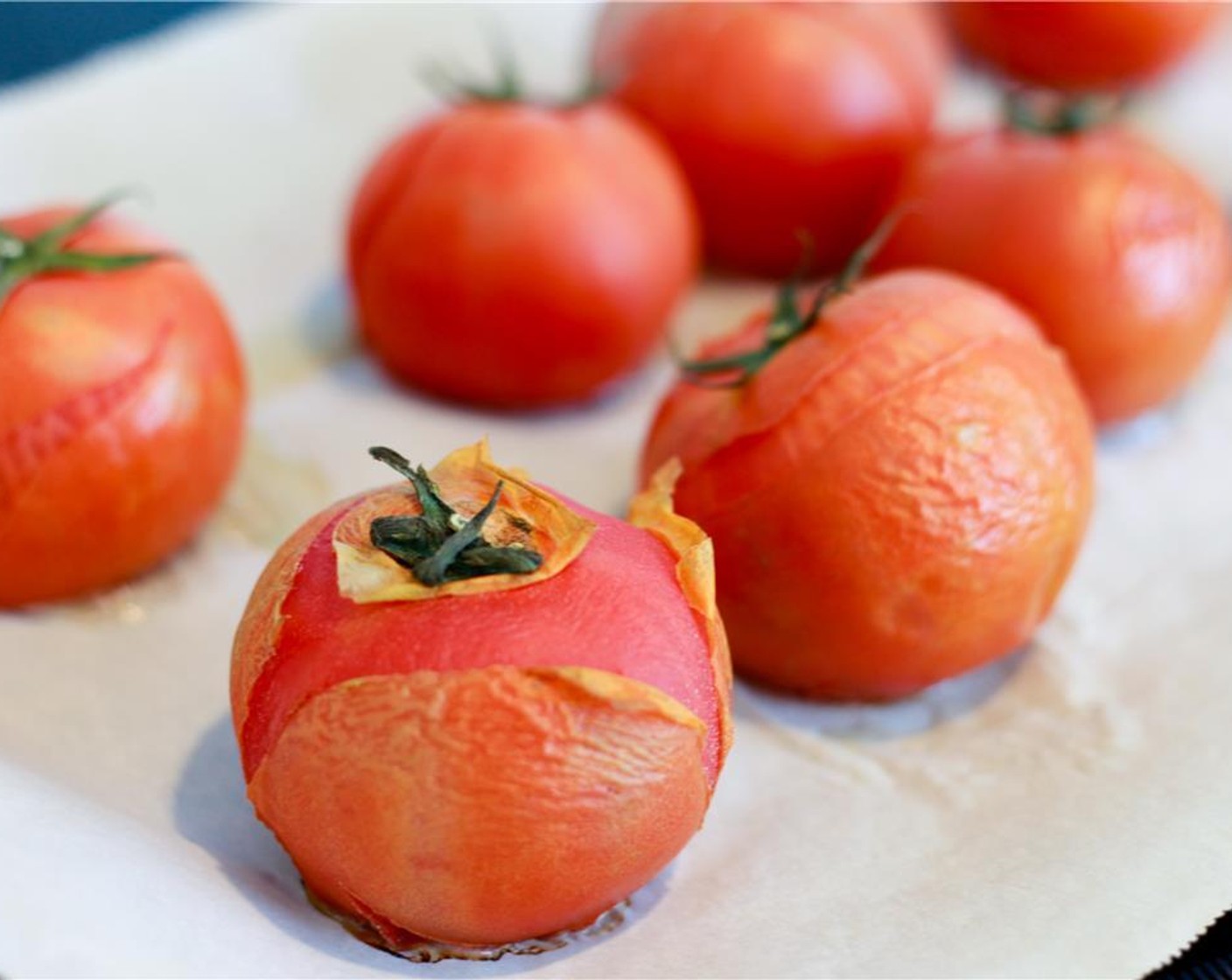 step 4 Place the Tomatoes (6) on a baking tray and bake for 15 minutes until the skin starts to peel, then allow to cool.