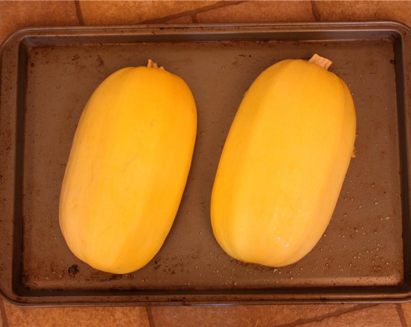 step 4 Place cut side down on a heavy baking or roasting pan. Cook for 30-35 minutes, or until the top is soft and gives to the touch.