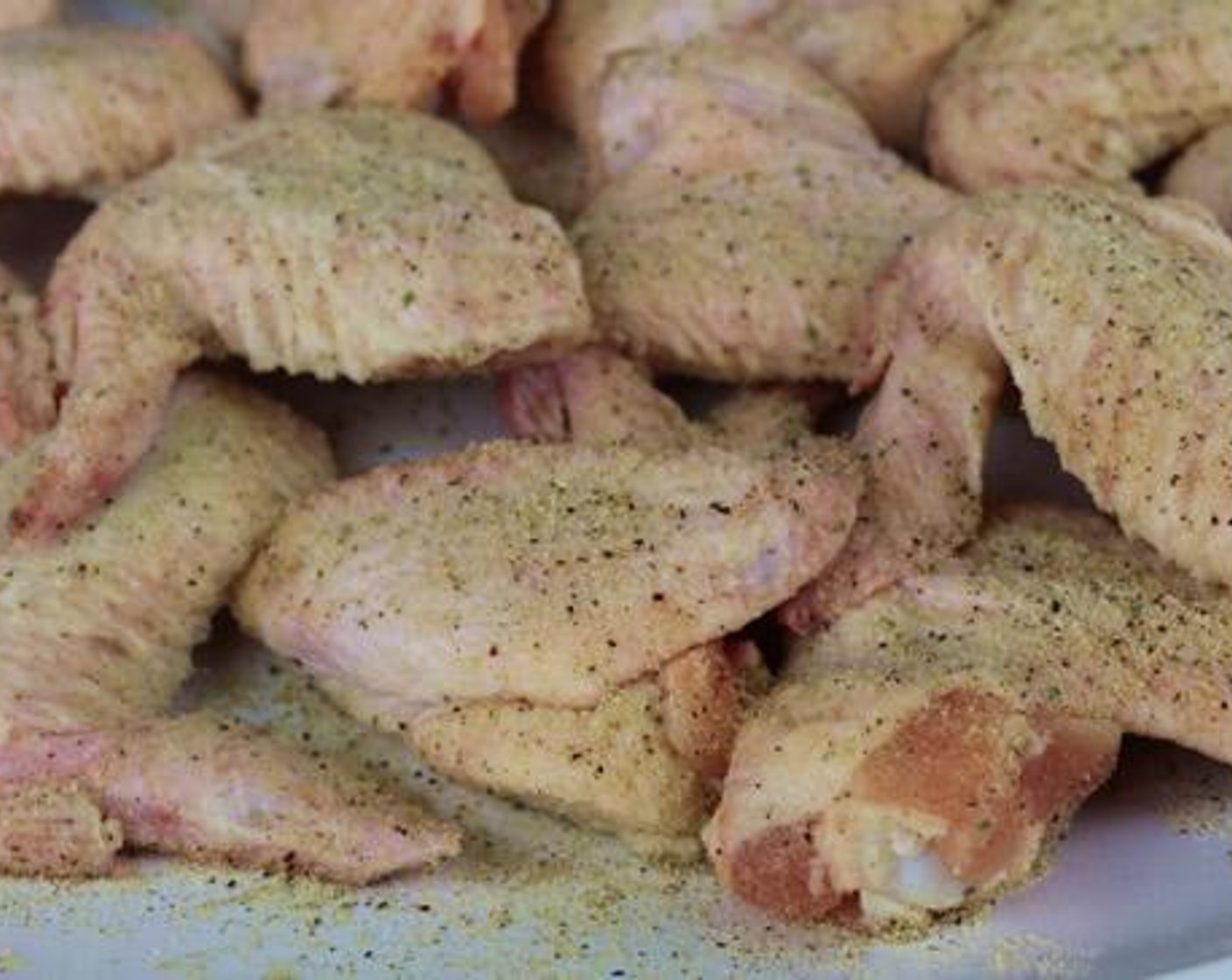 step 2 Season each Chicken Wings (12) with All-Purpose Spice Rub (1/4 cup) on both sides.