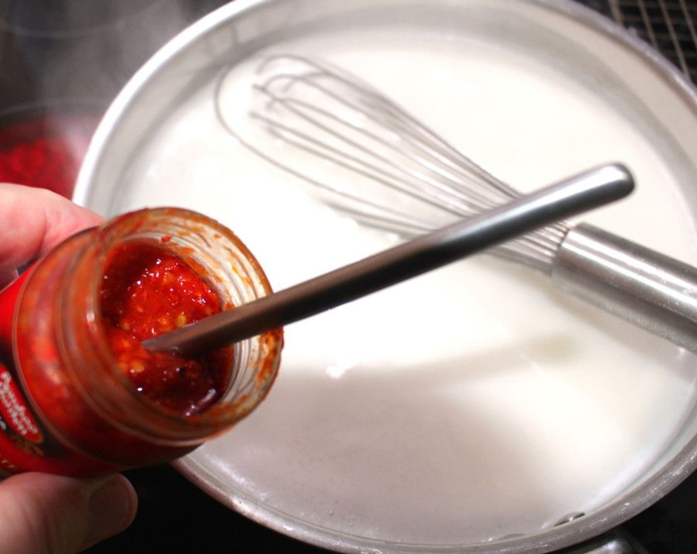 step 3 Add Chili Paste (2 Tbsp) and let simmer for 2 minutes.