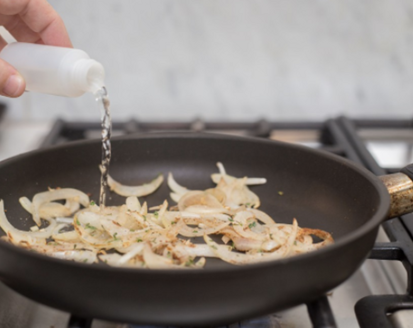 step 4 Place a sauté pan over medium heat, and add Olive Oil (1 tsp). When the oil is hot, add sliced onion and minced garlic and cook, stirring, until tender, about 5 minutes.