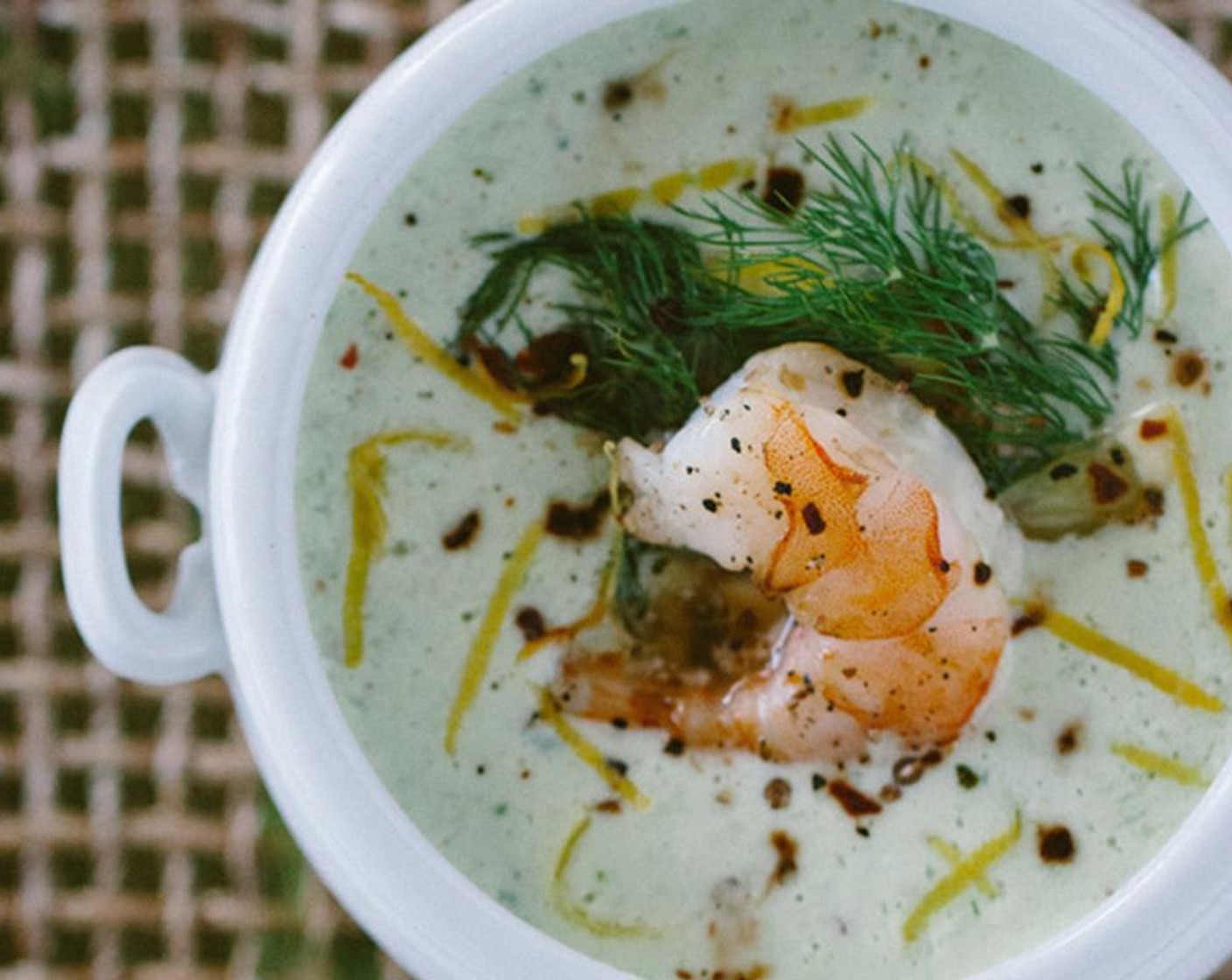 step 11 When ready to serve, ladle the chilled soup into bowls. Top it of with a couple of shrimp, fresh dill, sliced lemons, Crushed Red Pepper Flakes (1 pinch) and sprinkle it with coarse sea salt.