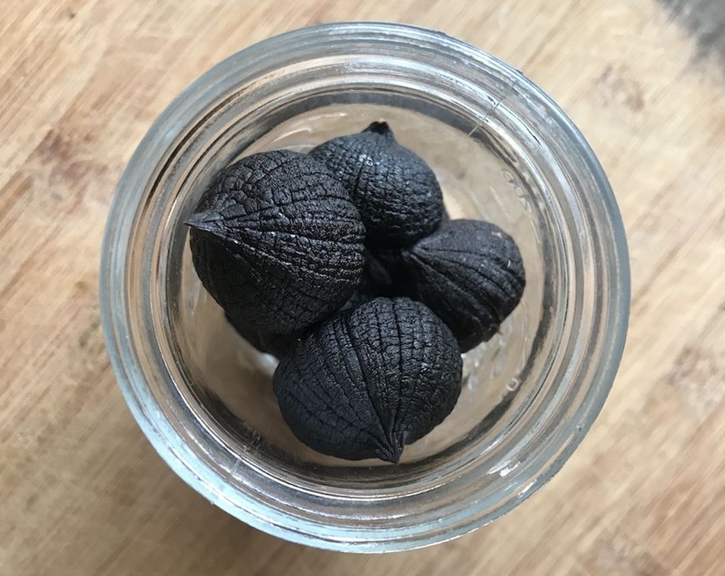 step 5 Enjoy your black garlic! Stored in an airtight container, it will keep for up to 6 months in the fridge. Peel it all at once if you want to take a pretty picture, otherwise just peel the cloves as needed.