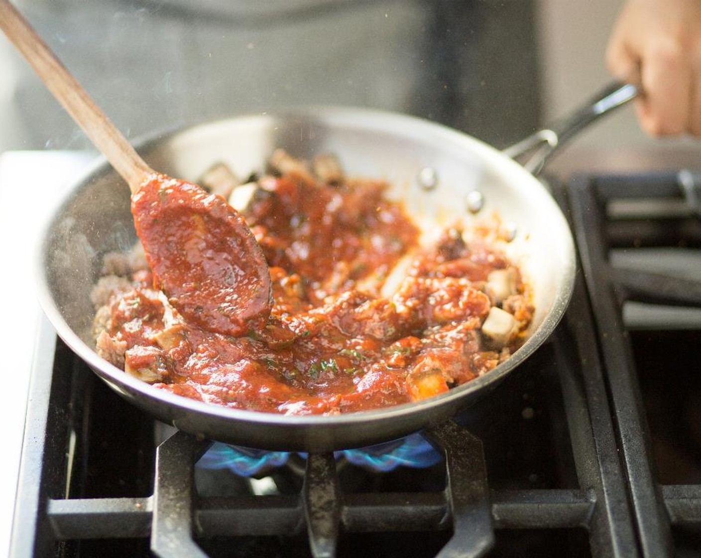 step 15 Add the Canned Crushed Tomatoes (1 3/4 cups), basil, and parsley to the pan and cook for 8 to 10 minutes until slightly thickened. Remove from heat and set aside for plating.