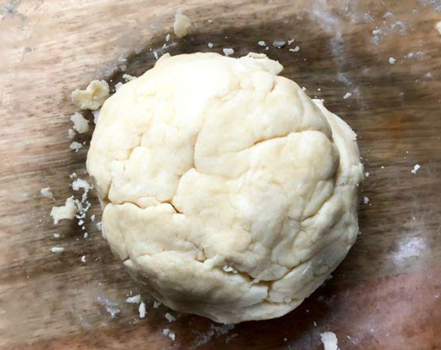 step 3 Repeat moistening dough, using Water (1 Tbsp) at a time, until all of the dough is moistened. Form the dough into a ball.