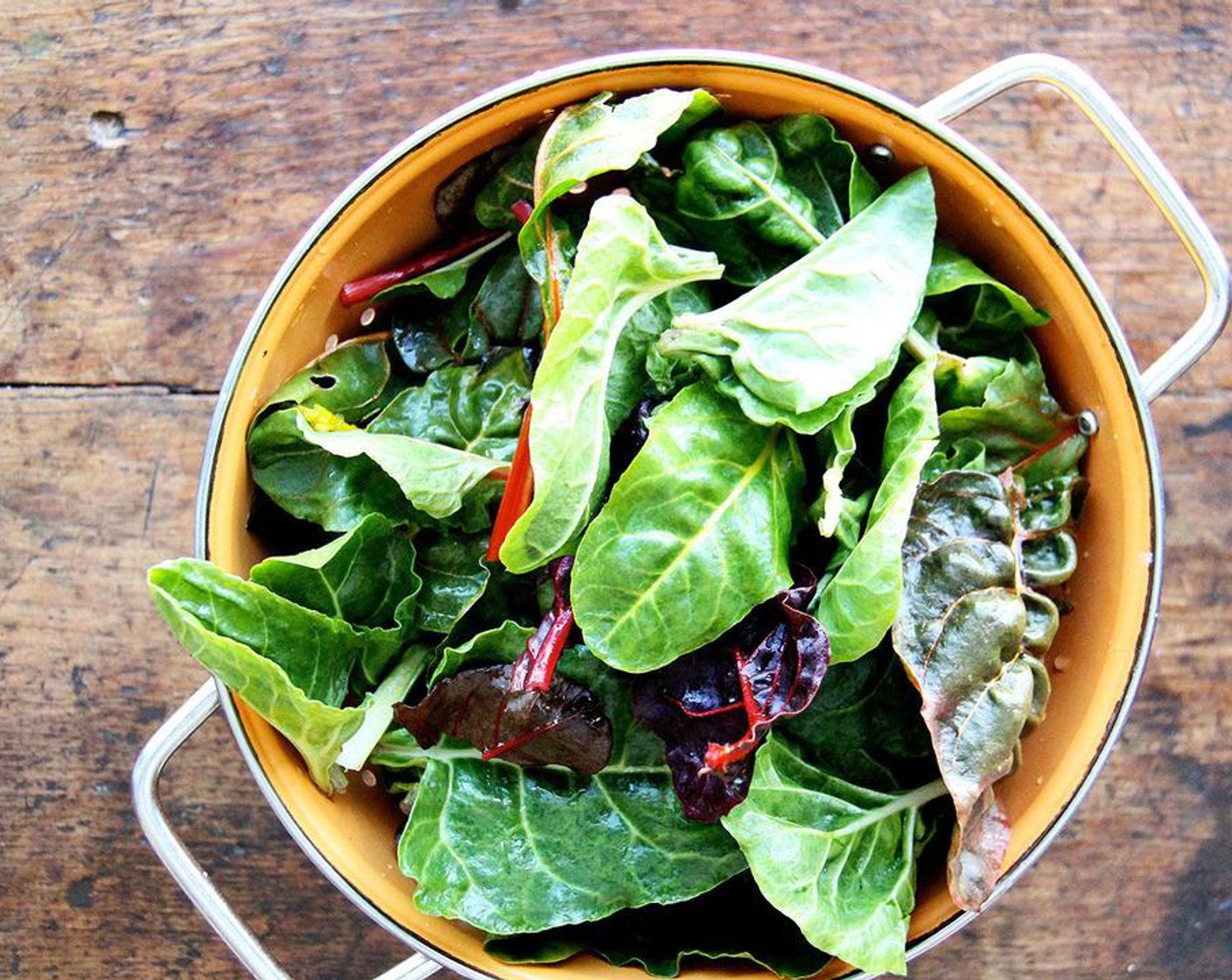 step 1 Place Chard (8 cups) in a large bowl and cover with cold water. Let sit for five minutes to allow any dirt to settle. Scoop greens from water and place in a large colander to drain. Any water clinging to the leaves is just fine.