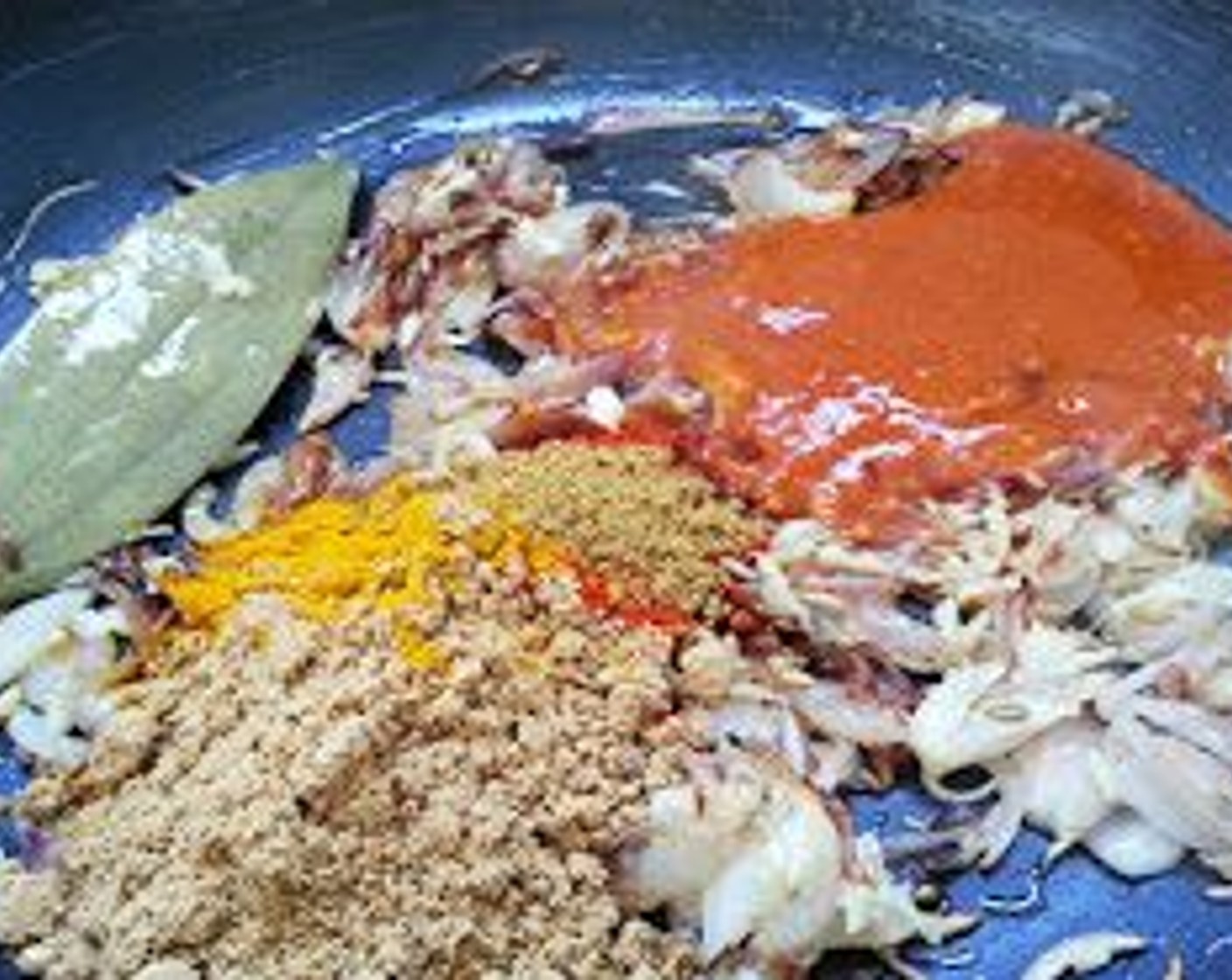 step 7 Add the Ground Turmeric (1/2 tsp), Kashmiri Red Chili Powder (1/2 tsp), Ground Coriander (1/2 Tbsp), Garam Masala (1/2 tsp), Fennel Seeds (1/2 tsp), and the chili paste.