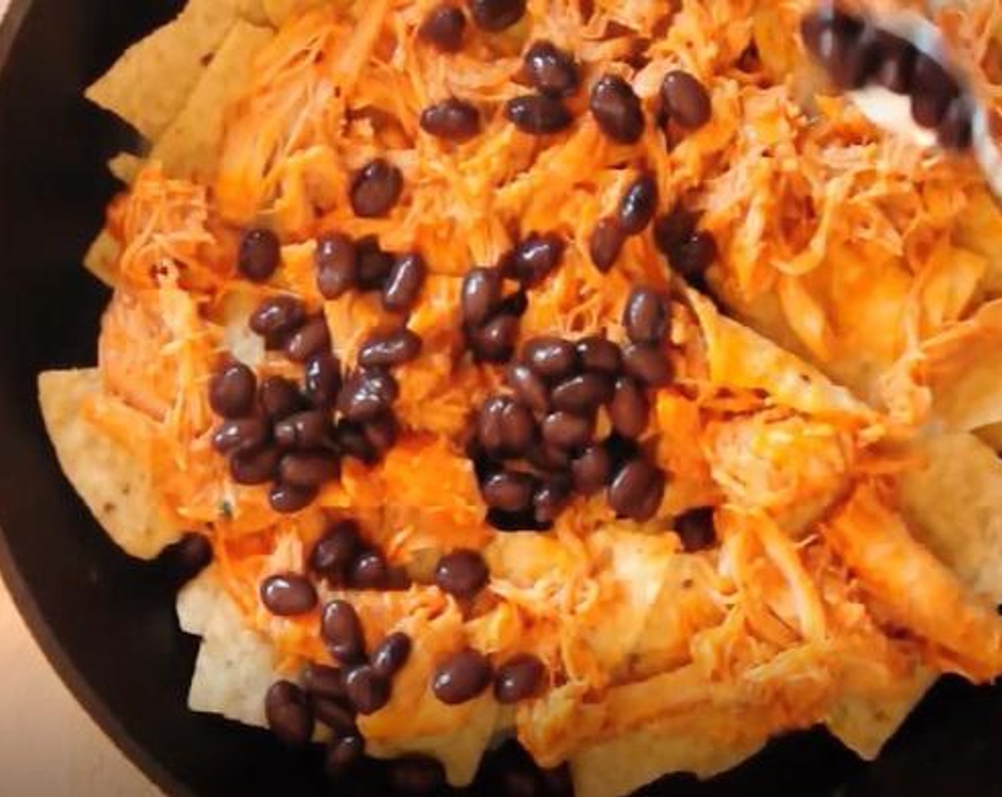 step 6 Sprinkle in half of the GOYA® Black Beans (1 cup).